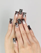Model wearing Shadow Forge Y2K metallic Singapore press on nails with silver shimmer accents by naillover
